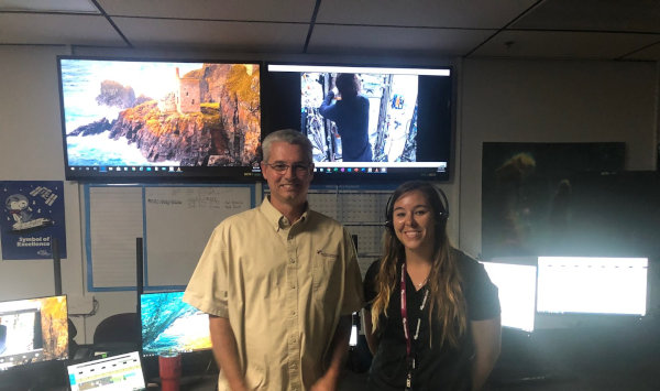 Woman and man standingin front of screens at the Veggie facility on the International Space Station Woman and man standingin front of screens at the Veggie facility on the International Space Station