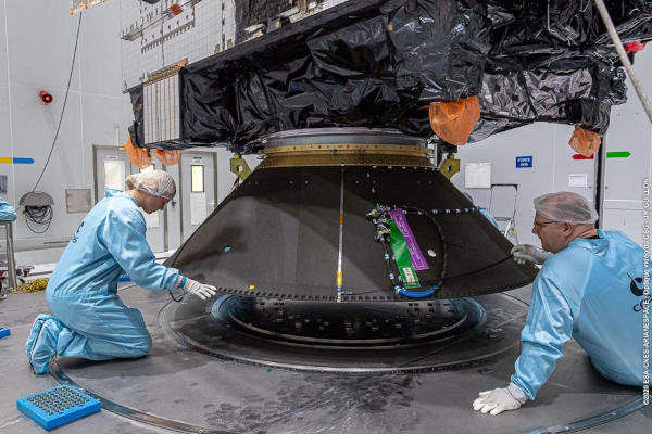 Woman working on JCSAT-17 encapulation Woman working on JCSAT-17 encapulation