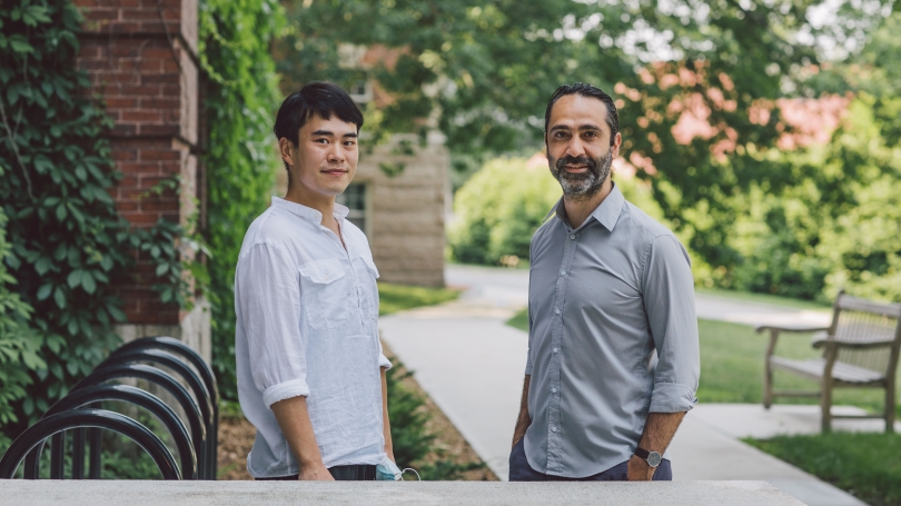 Researcher and professor on campus grounds Researcher and professor on campus grounds