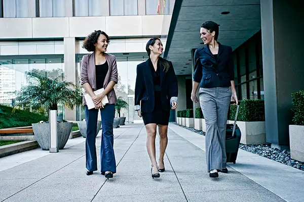 Professional women walking outdie office building