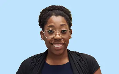 African American woman with glasses with smiling