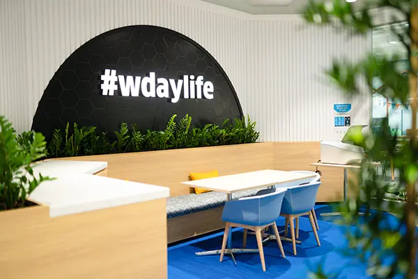 warm meeting area with table comfortable chairs and plants